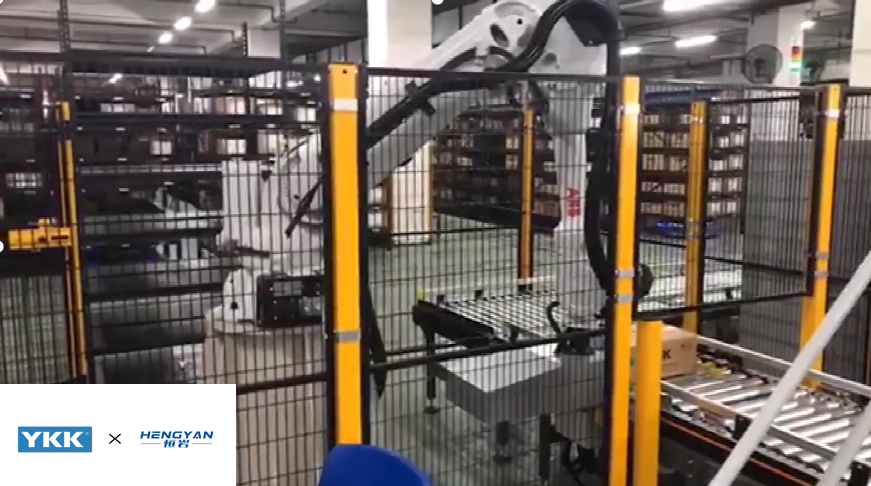 YKK goods-to-person automated warehouse with robotic arm