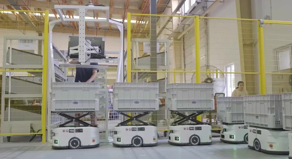 AMR robots transporting bins in ERAL automated warehouse